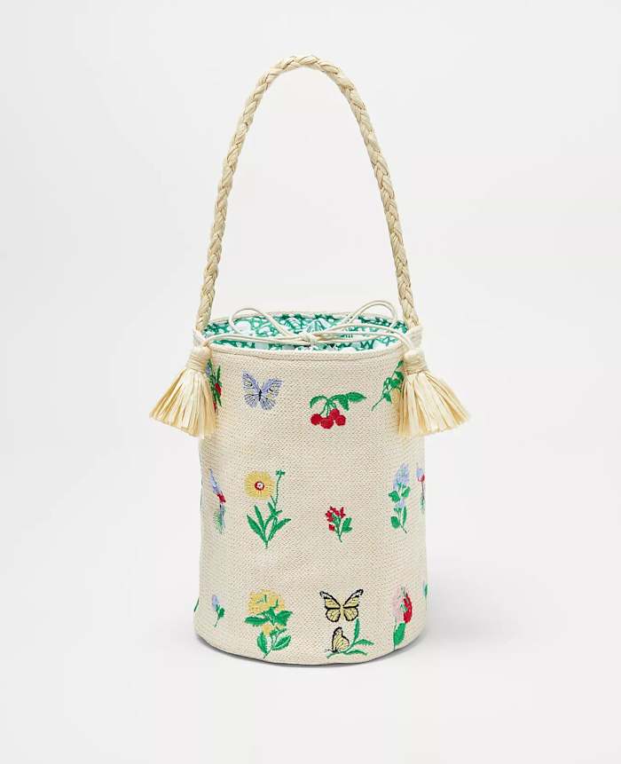With a braided rope handle and fringed tassels, this Ann Taylor bucket bag is a great addition to any look for the summer.